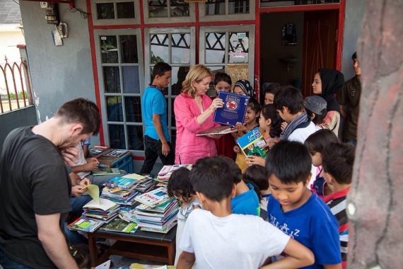 children at Cisarua refugee learning centre look at new books