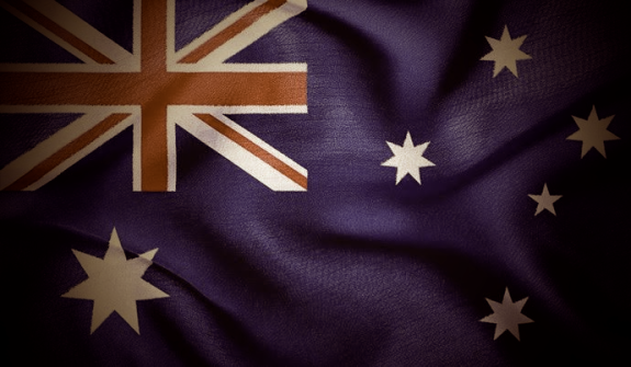 The Australian flag shadowed and dimmed.